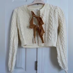 Storia Cream Cable Knit Cardigan with Brown Bow